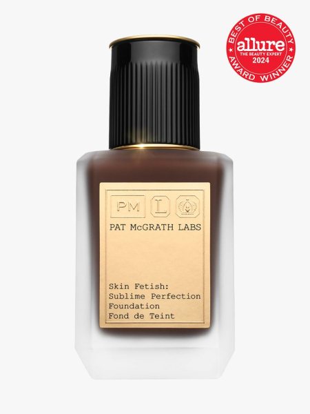 foundation in branded clear bottle with gold and black cap on light gray background with red and white 2024 allure best of beauty seal
