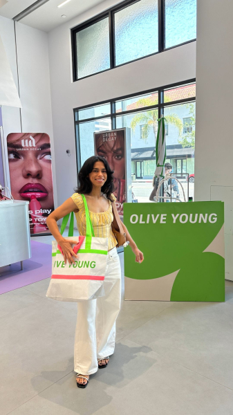 Shanna Shipin holding an Olive Young bag