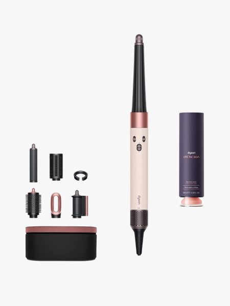 Dyson Airwrap i.d. & Chitosan Post-Style Serum in multiple branded components on a light gray background